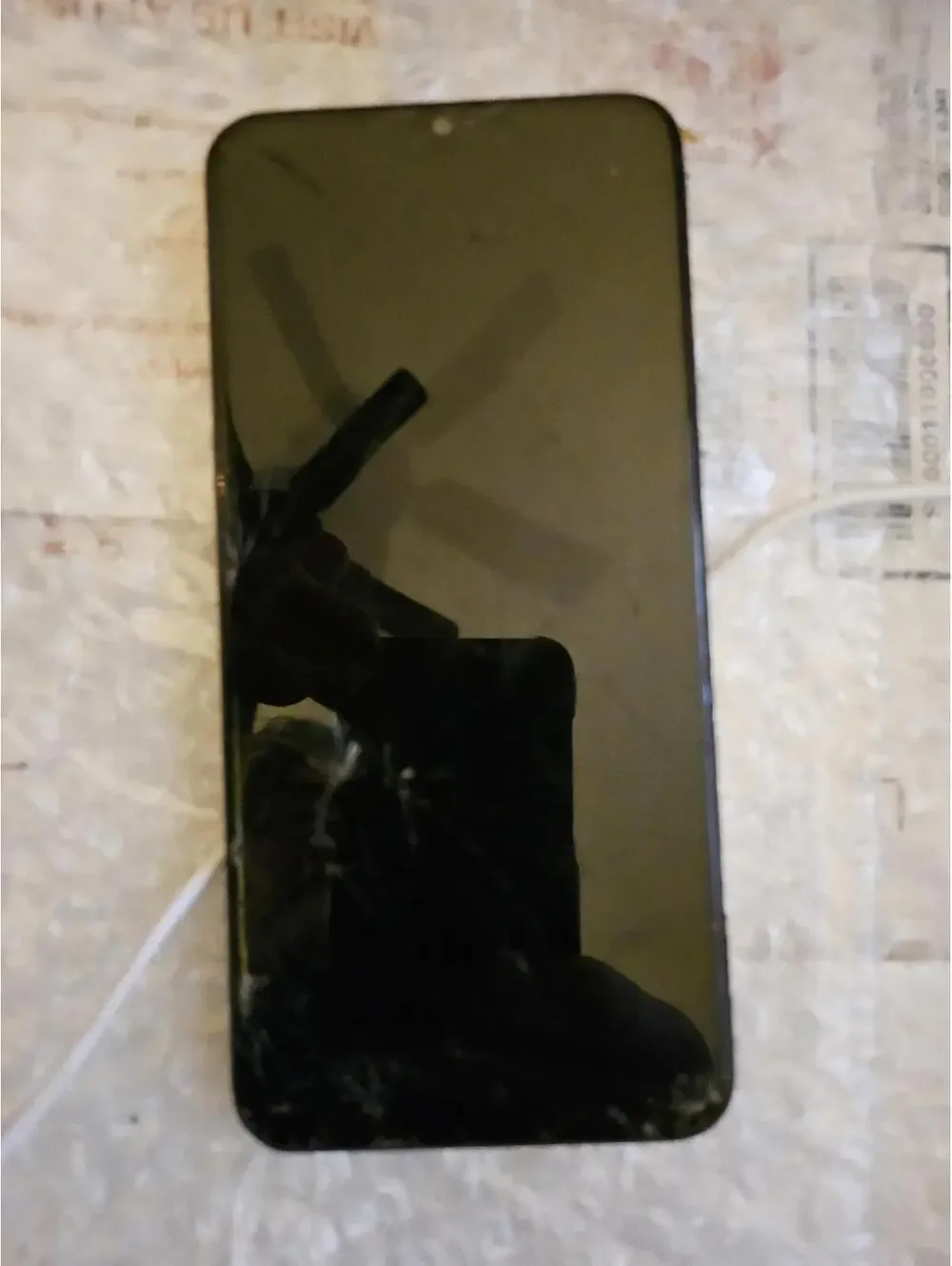 Samsung Android Smartphone. No charger cord. Untested as is. Cracked no back